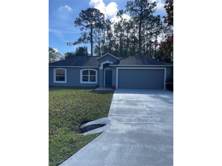 This well maintained Maronda block built home is waiting for - Beach Home for sale in Palm Coast, Florida on Beachhouse.com