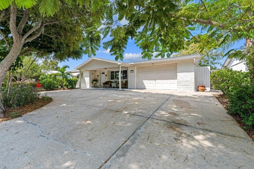 Step into your own tropical 3-bedroom/2-bathroom home! It spans - Beach Home for sale in Port Richey, Florida on Beachhouse.com