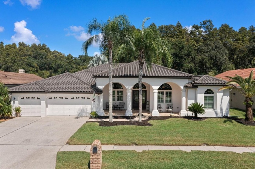 Welcome to your new executive home in gated Crescent Oaks. This - Beach Home for sale in Tarpon Springs, Florida on Beachhouse.com