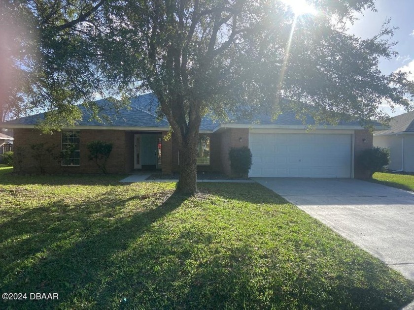 Nicely updated 4-bedroom, 3 full bath brick home in the - Beach Home for sale in Palm Coast, Florida on Beachhouse.com