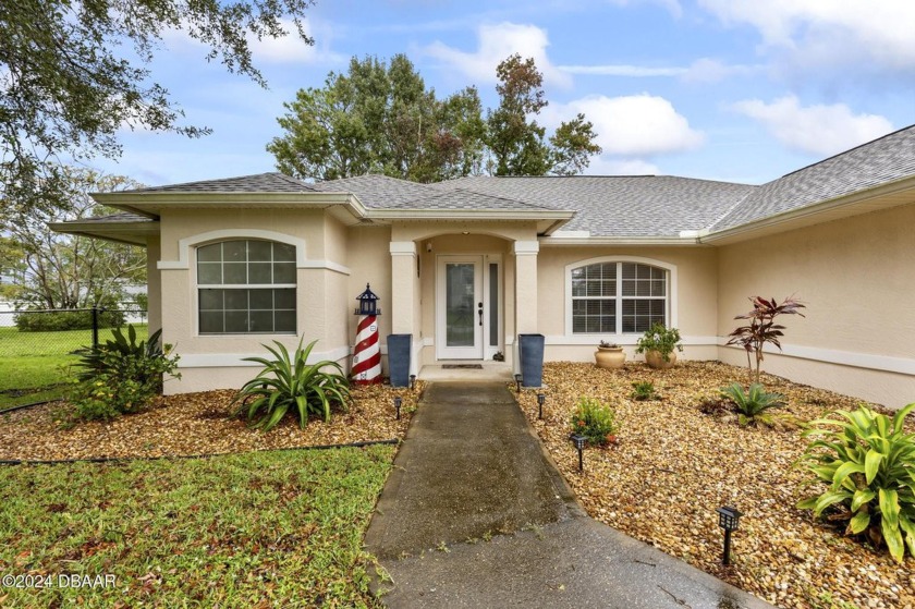 Nestled in the heart of Palm Coast, 65 Foxhall Lane is a - Beach Home for sale in Palm Coast, Florida on Beachhouse.com