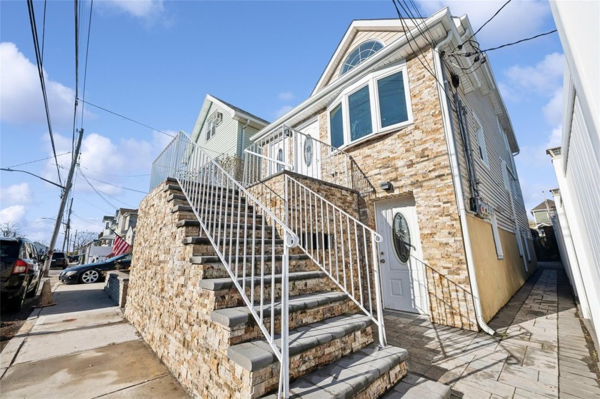 Welcome to this beautifully renovated three-family home in - Beach Townhome/Townhouse for sale in Howard Beach, New York on Beachhouse.com