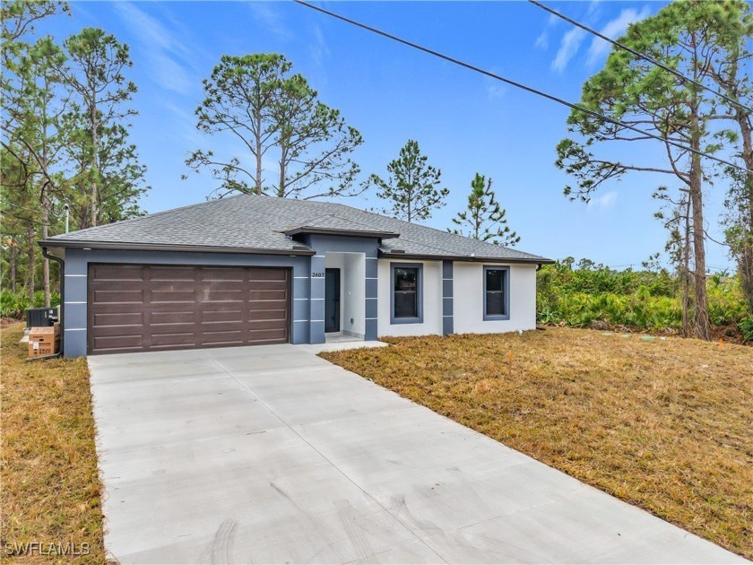 Stunning 3-Bedroom Home in Prime Lehigh Acres Location. This - Beach Home for sale in Lehigh Acres, Florida on Beachhouse.com