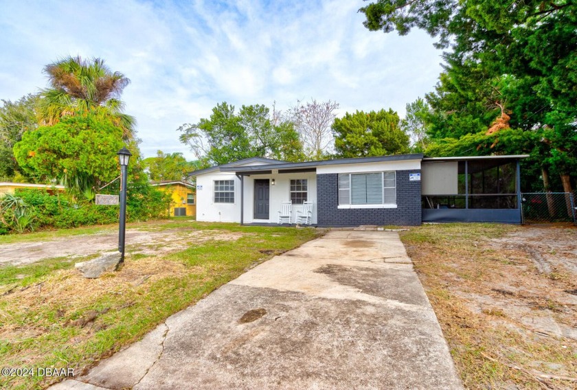 Welcome to this charming 4-bedroom, 1.5-bath concrete block home - Beach Home for sale in Daytona Beach, Florida on Beachhouse.com