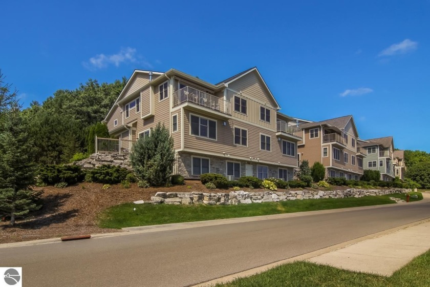 Enjoy amazing West Bay and Downtown views from this Craftsmen - Beach Condo for sale in Traverse City, Michigan on Beachhouse.com