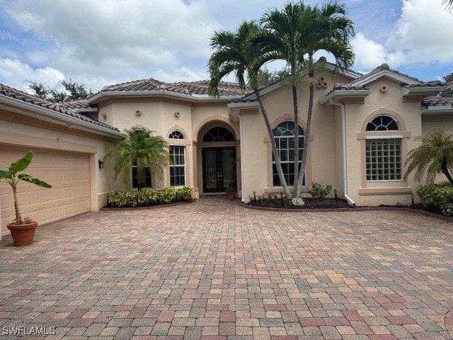 Step into the covered entry and elegant foyer, a formal dining - Beach Home for sale in Estero, Florida on Beachhouse.com