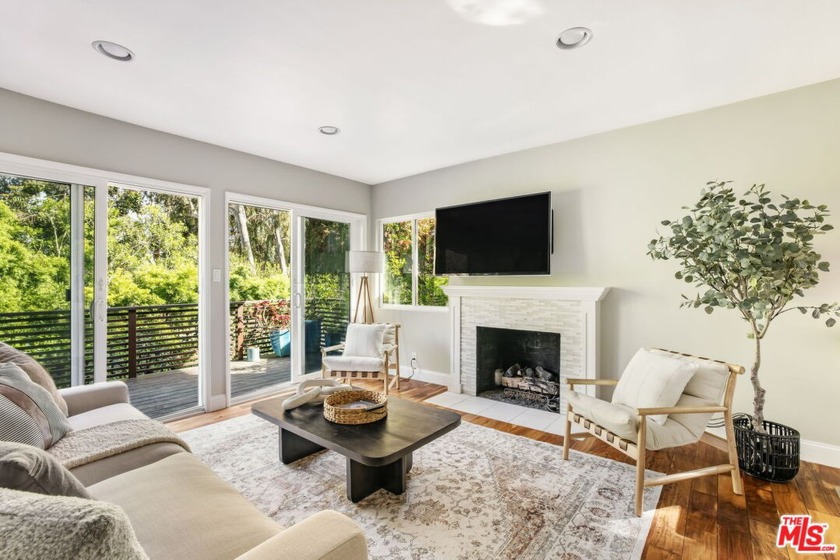 Tucked away on a lane off of Sunset Blvd, this charming three - Beach Home for sale in Pacific Palisades, California on Beachhouse.com