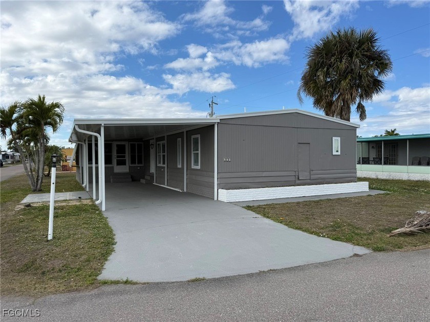 Welcome to 14703 Tea Party Ln, located in a sought-after 55+ - Beach Home for sale in North Fort Myers, Florida on Beachhouse.com