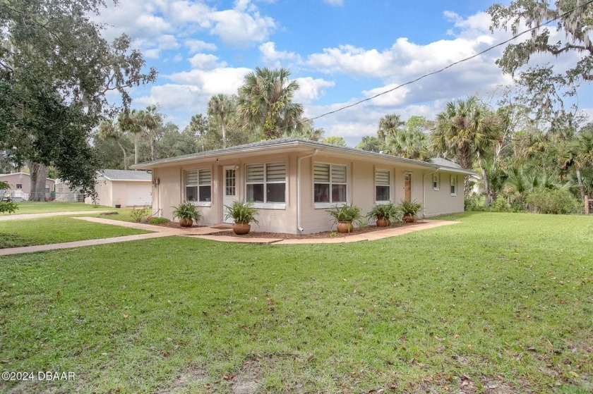 Nestled in the heart of New Smyrna Beach, this charming bungalow - Beach Home for sale in New Smyrna Beach, Florida on Beachhouse.com