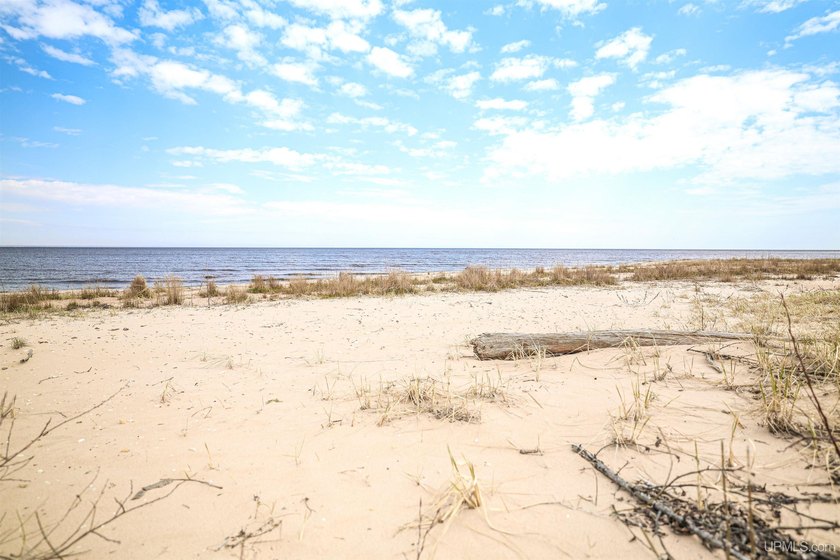 Wake up to breathtaking sunrise views over Lake Michigan from - Beach Lot for sale in Manistique, Michigan on Beachhouse.com
