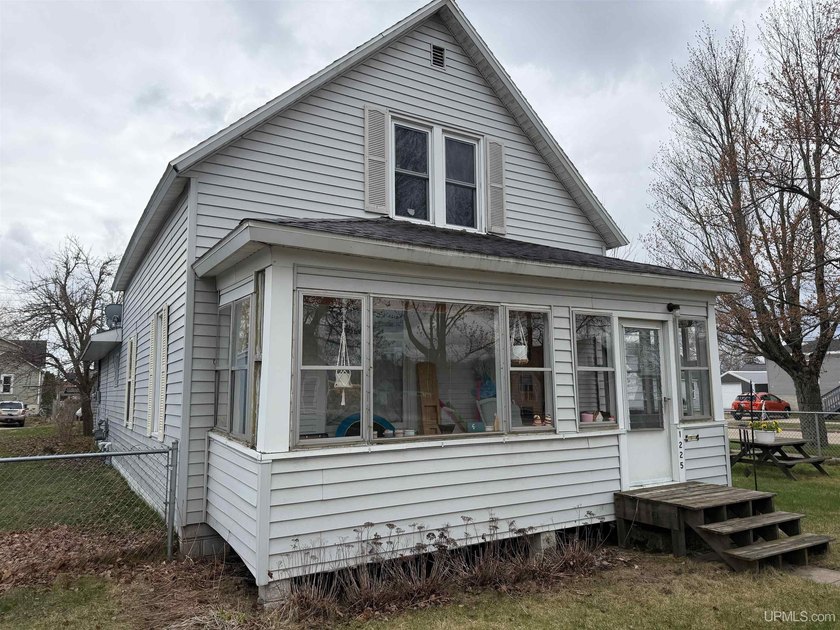 Step into comfort and space with this well-maintained 5-bedroom - Beach Home for sale in Gladstone, Michigan on Beachhouse.com
