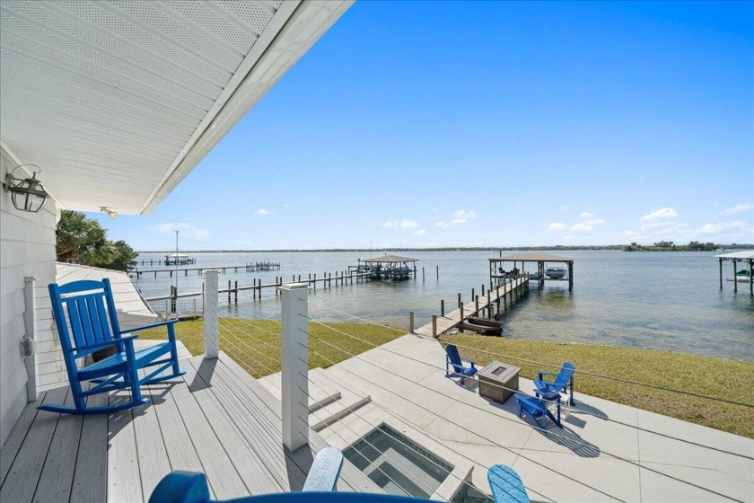 Nestled along 117 feet of Indian River waterfront in a - Beach Home for sale in Merritt Island, Florida on Beachhouse.com