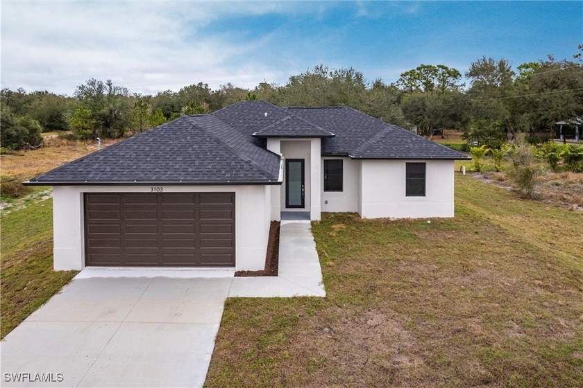 Discover this beautifully crafted NEW CONSTRUCTION home, built - Beach Home for sale in Lehigh Acres, Florida on Beachhouse.com