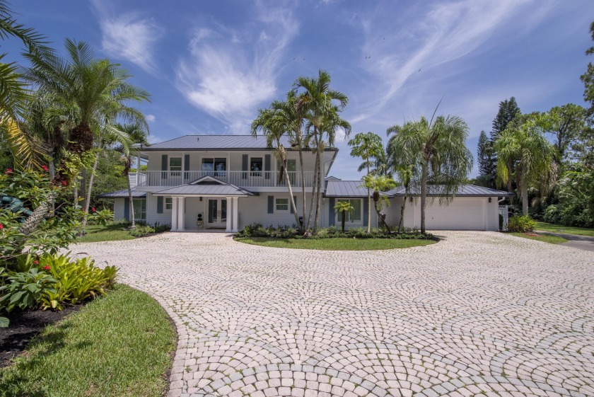 Escape to your private South Florida sanctuary, a modern French - Beach Home for sale in Palm Beach Gardens, Florida on Beachhouse.com