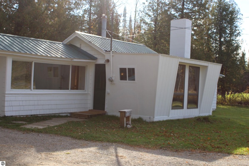 Check out the oasis consisting of over 4 acres of wooded - Beach Home for sale in Traverse City, Michigan on Beachhouse.com