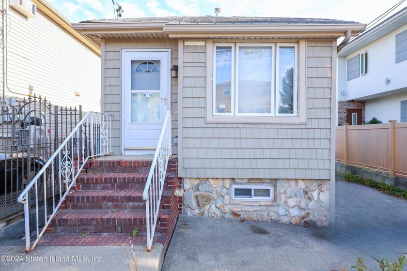 Discover the charm of this delightful detached single-family - Beach Home for sale in Staten Island, New York on Beachhouse.com