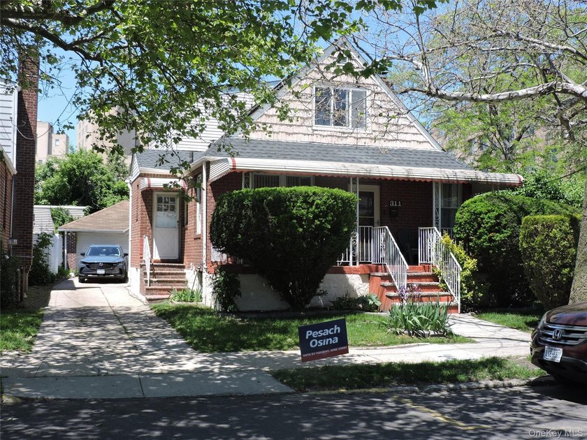 This versatile two-family Cape offers the best of both worlds - Beach Home for sale in Far Rockaway, New York on Beachhouse.com