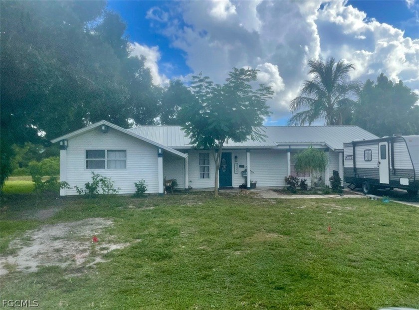 Escape to tranquility in this beautiful 3-bedroom, 3-bathroom - Beach Home for sale in Lehigh Acres, Florida on Beachhouse.com