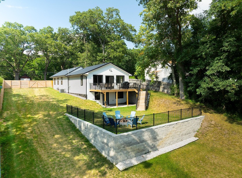 Experience lakefront living with this beautifully updated fully - Beach Home for sale in Muskegon, Michigan on Beachhouse.com