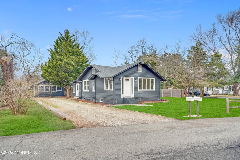 Tucked away on a quiet, lake front private street in Brick, this - Beach Home for sale in Brick, New Jersey on Beachhouse.com