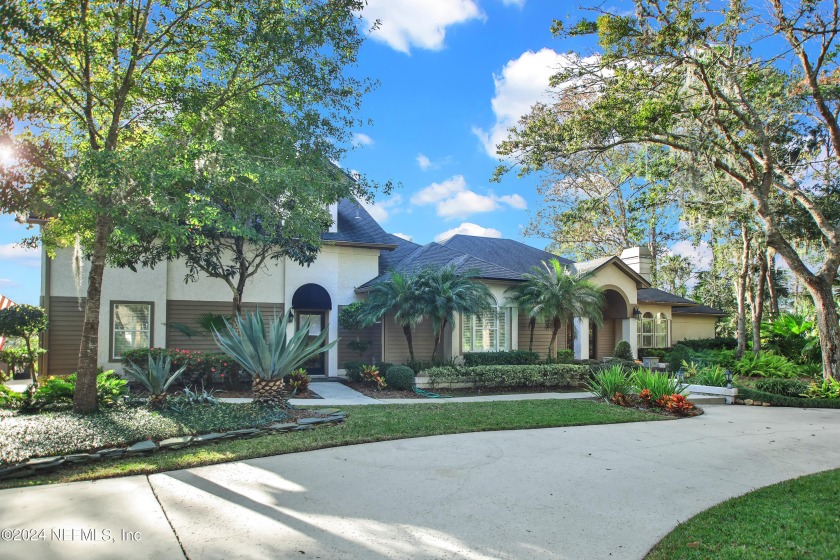 This stunning Marsh Landing home is nestled among the trees on - Beach Home for sale in Ponte Vedra Beach, Florida on Beachhouse.com