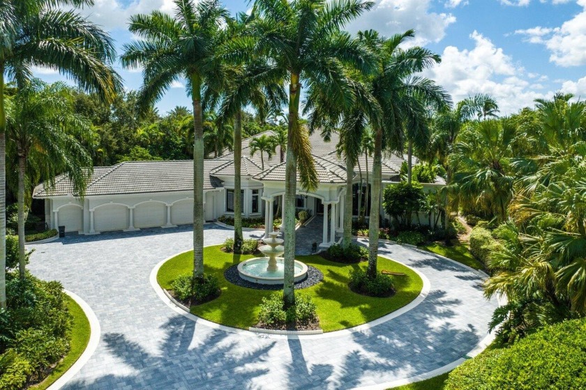 Situated on a quiet street, this estate home is located in - Beach Home for sale in Palm Beach Gardens, Florida on Beachhouse.com