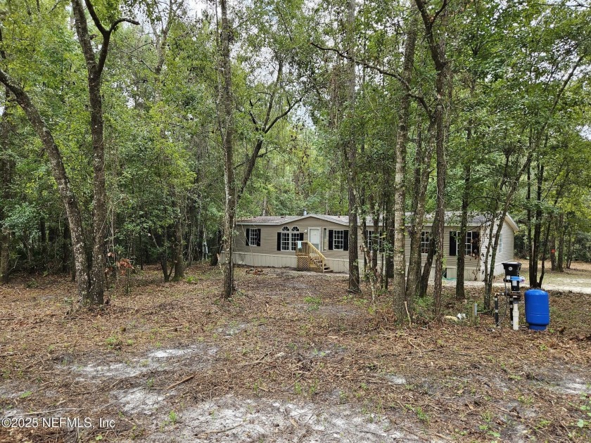 NO HOA Here! This lovely home is situated on 1.7 acres that - Beach Home for sale in Middleburg, Florida on Beachhouse.com