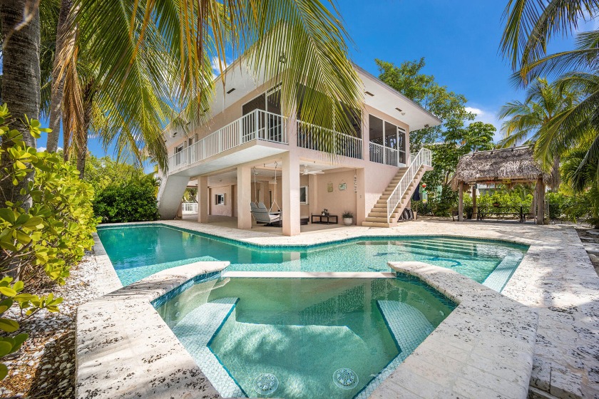 This fully fenced Key Largo concrete home offers a charming - Beach Home for sale in Key Largo, Florida on Beachhouse.com