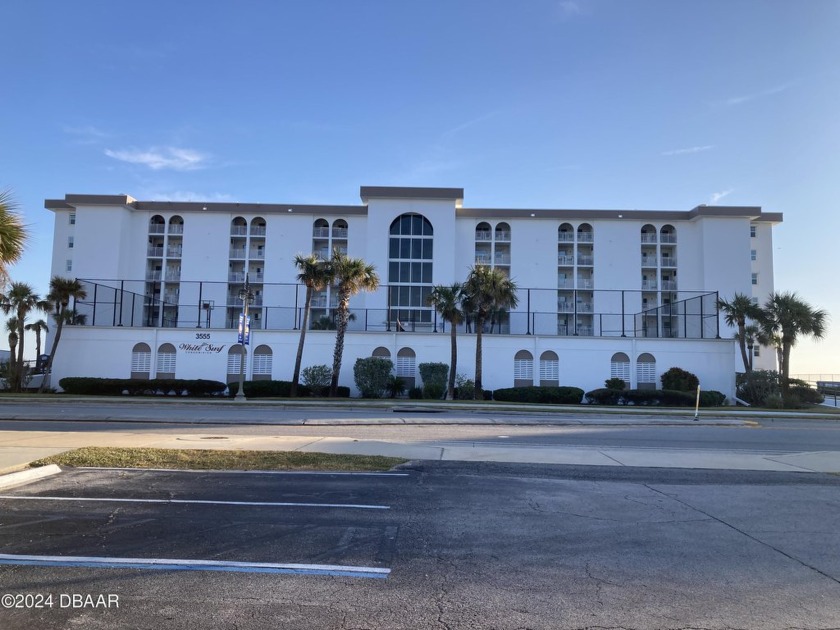 This first-floor unit with Floor to ceiling windows/sliders - Beach Condo for sale in Daytona Beach, Florida on Beachhouse.com