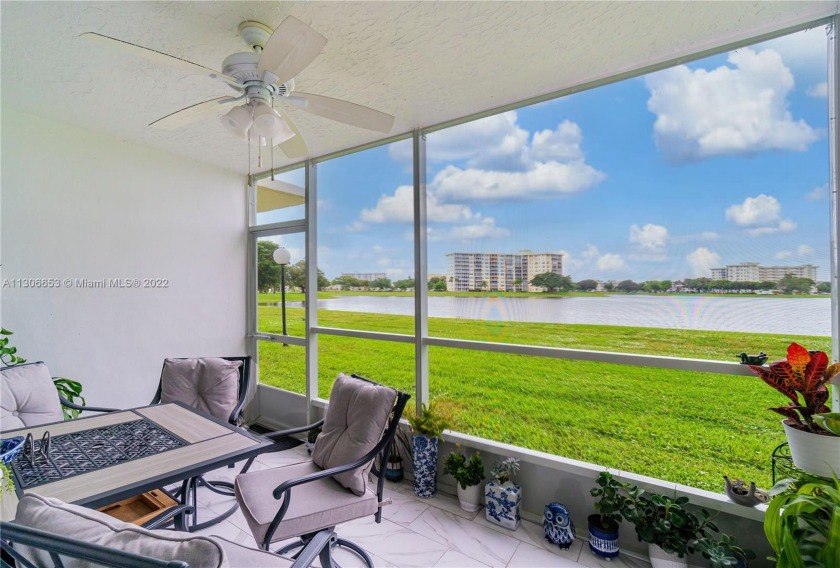 Enjoy A Beautiful Lake View From A Large Screened-In Patio In - Beach Condo for sale in Pompano  Beach, Florida on Beachhouse.com