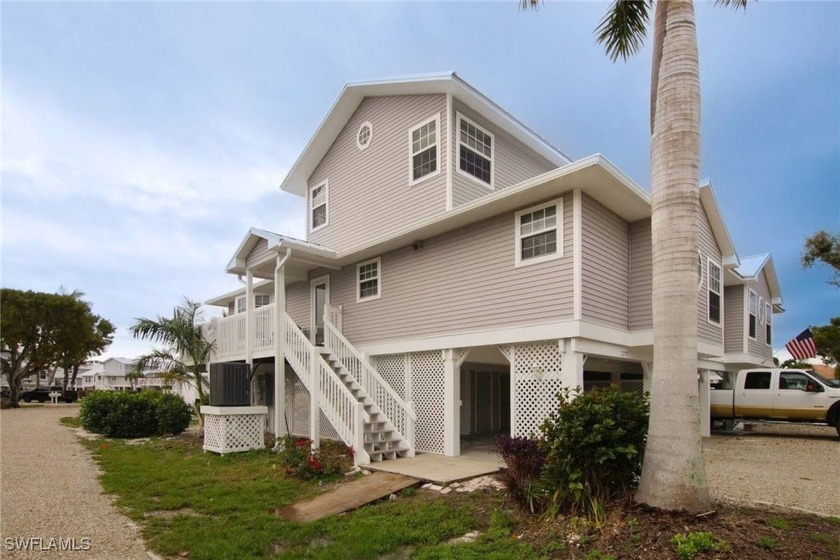 Welcome to this exquisite three-bedroom, two-bathroom waterfront - Beach Home for sale in St. James City, Florida on Beachhouse.com