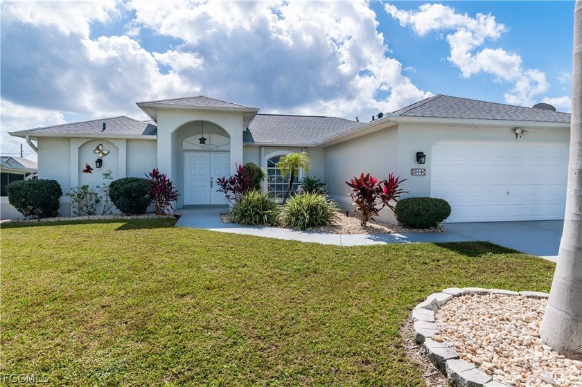 Located in the heart of Cape Coral, this charming pool home - Beach Home for sale in Cape Coral, Florida on Beachhouse.com