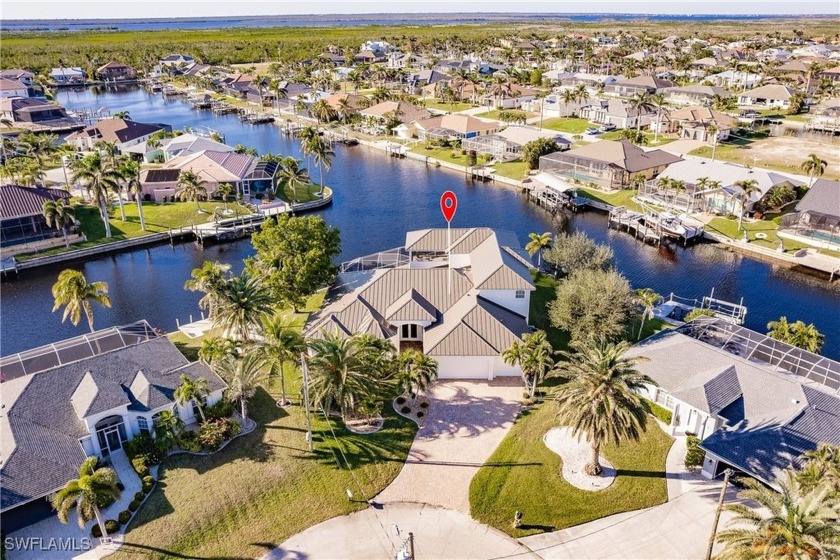 Luxury Waterfront at its Finest!  This Turnkey custom home takes - Beach Home for sale in Cape Coral, Florida on Beachhouse.com