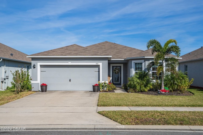 Located in the desirable community of Coastal Woods, you will - Beach Home for sale in New Smyrna Beach, Florida on Beachhouse.com