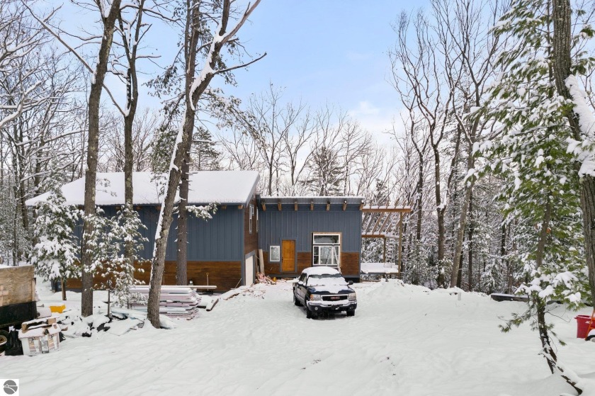 The construction is nearly complete on this exceptionally modern - Beach Home for sale in Traverse City, Michigan on Beachhouse.com