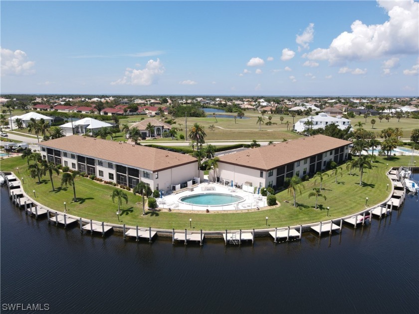 This desirable FIRST FLOOR END UNIT overlooks intersecting - Beach Condo for sale in Punta Gorda, Florida on Beachhouse.com