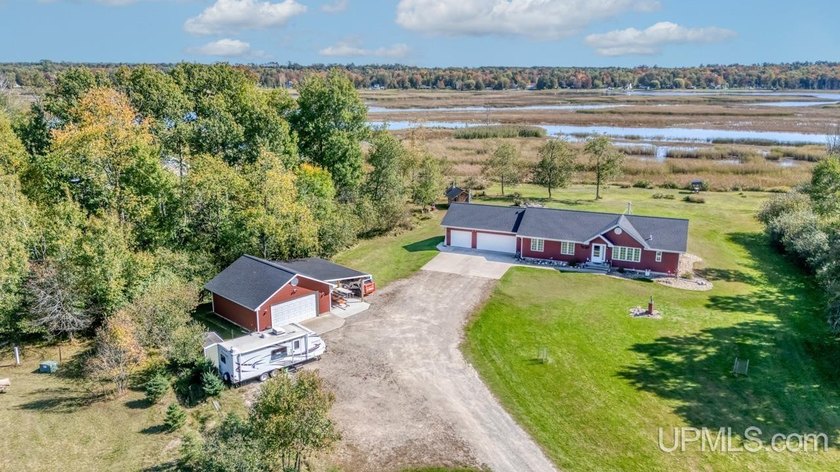 Your Riverfront Retreat Awaits! Experience peace, privacy, and - Beach Home for sale in Rapid River, Michigan on Beachhouse.com