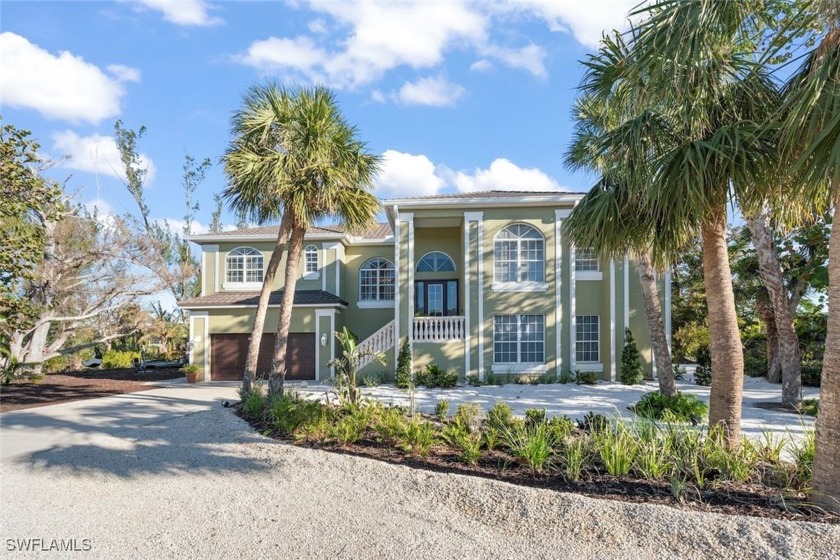 RARE POURED CONCRETE CONSTRUCTION! Welcome to your tropical - Beach Home for sale in Sanibel, Florida on Beachhouse.com