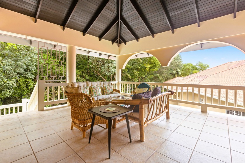 Situated within the lush tropical grounds of Los Porticos Villas - Beach Condo for sale in Placencia,  on Beachhouse.com