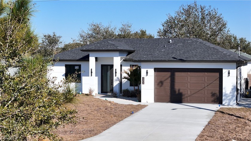 OUTDOOR KITCHEN + COVERED LANAI | CENTRALLY LOCATED | UP TO $10 - Beach Home for sale in Lehigh Acres, Florida on Beachhouse.com