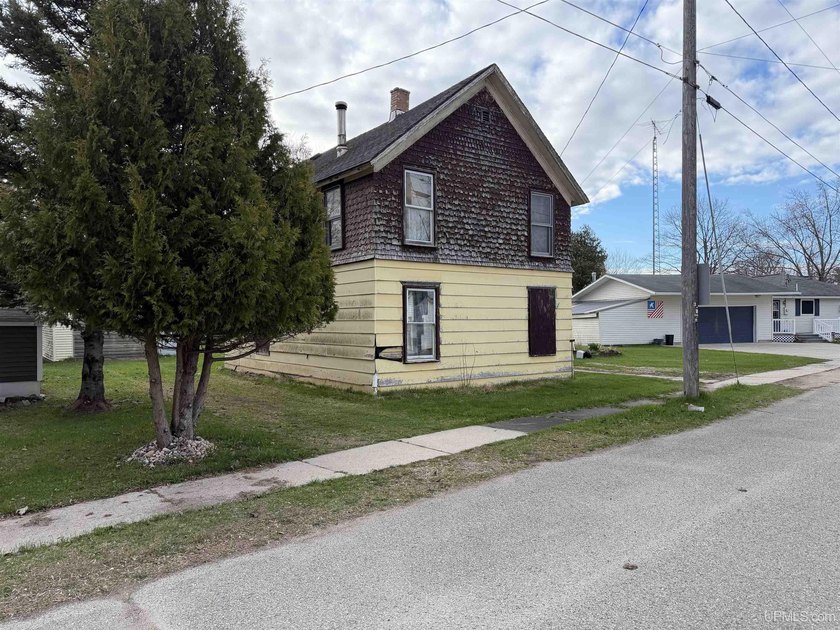 This fixer-upper is located on the highly sought-after Garden - Beach Home for sale in Garden, Michigan on Beachhouse.com
