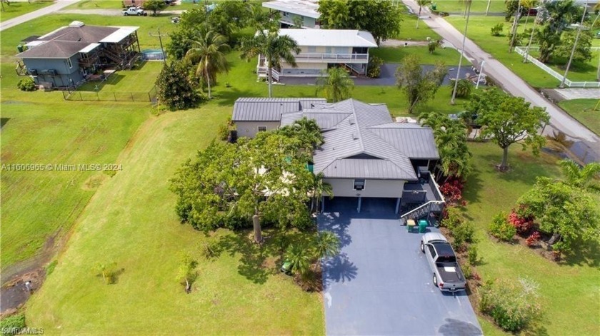 The main residence, perched on stilts, features 3 bedrooms and 2 - Beach Home for sale in Everglades City, Florida on Beachhouse.com