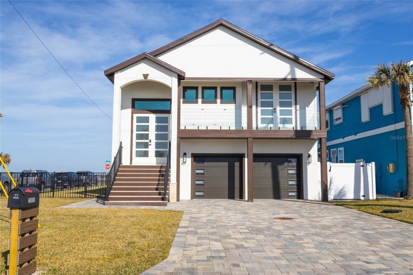 This stunning oceanfront home, located on a prime corner lot in - Beach Home for sale in Flagler Beach, Florida on Beachhouse.com