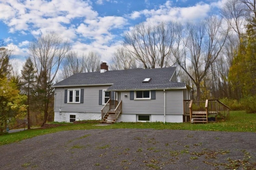 Welcome to this Charming and Spacious Three Bedroom Home In the - Beach Home for sale in Wolcott, New York on Beachhouse.com