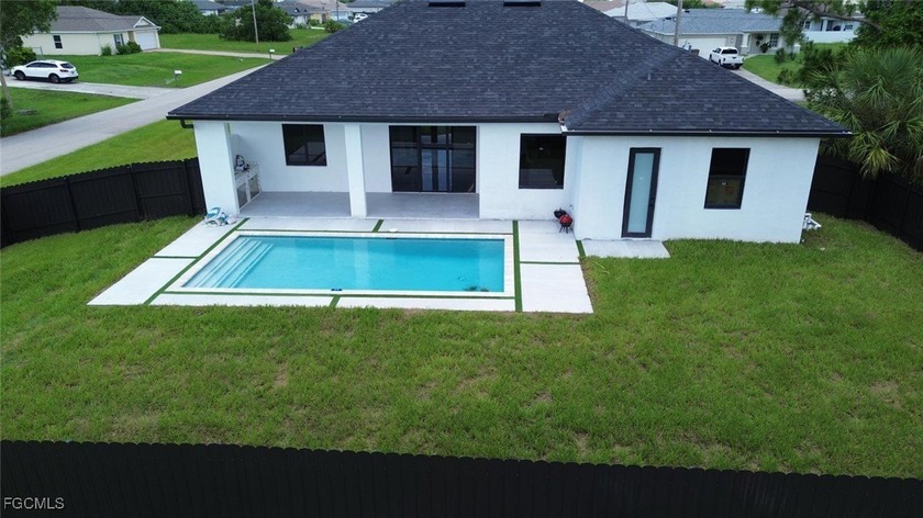 BRAND NEW POOL HOME WITH FENCE!! STUNNING NEW CONSTRUCTION 2024 - Beach Home for sale in Cape Coral, Florida on Beachhouse.com