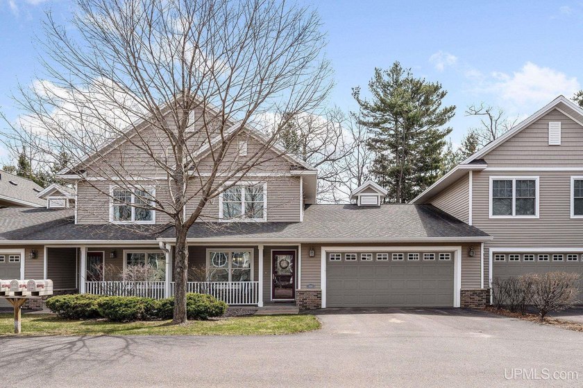 Tucked into a quiet Eastside cul-de-sac, this 2-story end-unit - Beach Condo for sale in Marquette, Michigan on Beachhouse.com