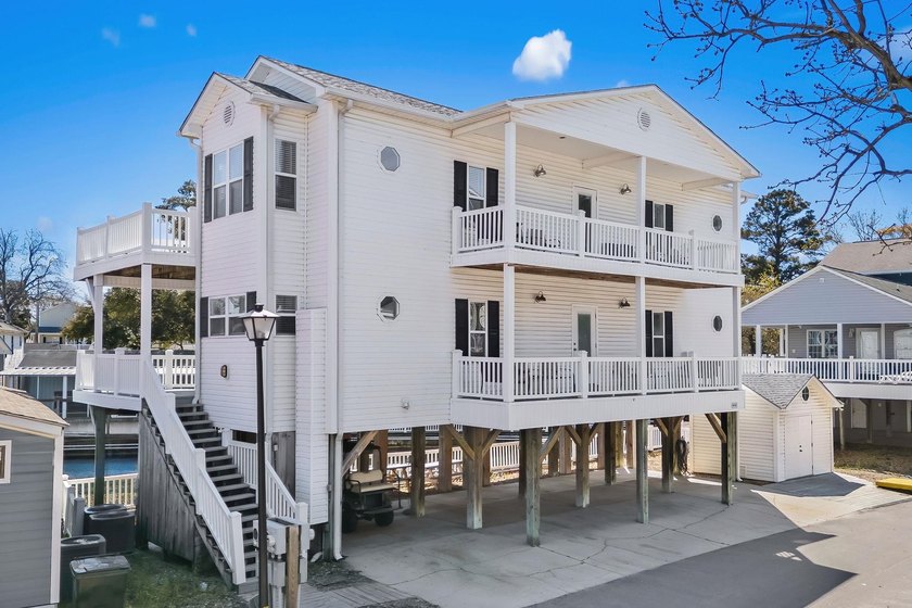STUNNING 4 BED/4 BATH LAKEFRONT RAISED BEACH HOUSE WITH TONS OF - Beach Home for sale in Myrtle Beach, South Carolina on Beachhouse.com