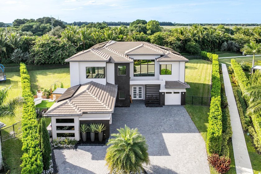 Nestled behind the prestigious gates of Boca Bridges, this 6 - Beach Home for sale in Boca Raton, Florida on Beachhouse.com