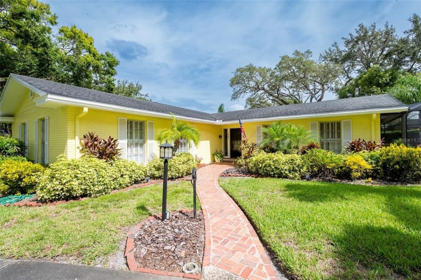 Charming 4-bedroom, 2.5-bathroom home nestled on a 1/3 acre lot - Beach Home for sale in Dunedin, Florida on Beachhouse.com