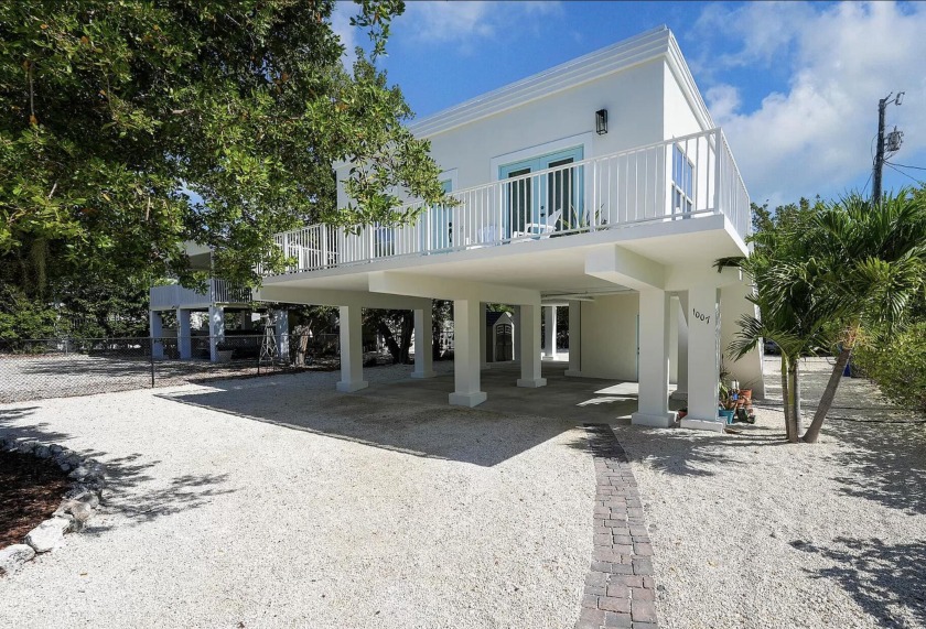 STEP INSIDE THIS BEAUTIFUL CONCRETE HOME WITH CONCRETE ROOF - Beach Home for sale in Key Largo, Florida on Beachhouse.com